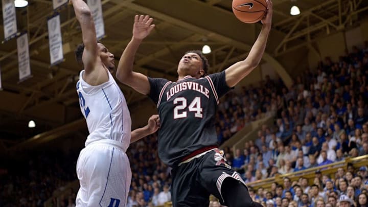 DURHAM, NC - FEBRUARY 21: Dwayne Sutton #24 of the Louisville Cardinals drives against Javin DeLaurier #12 of the Duke Blue Devils during their game at Cameron Indoor Stadium on February 21, 2018 in Durham, North Carolina. Duke won 82-56. (Photo by Grant Halverson/Getty Images)