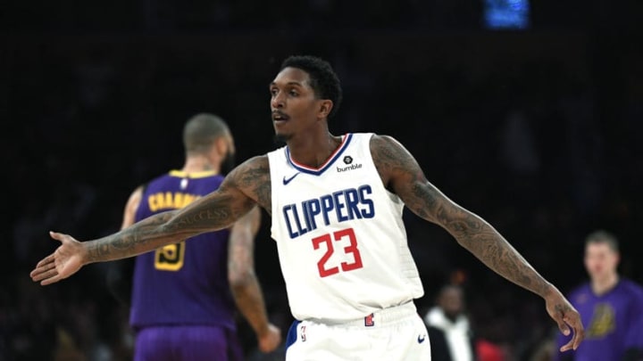 LOS ANGELES, CA - DECEMBER 28: Lou Williams #23 of the Los Angeles Clippers celebrates after scoring a three point basket to beat the halftime buzzer against against Los Angeles Lakers at Staples Center on December 28, 2018 in Los Angeles, California. NOTE TO USER: User expressly acknowledges and agrees that, by downloading and or using this photograph, User is consenting to the terms and conditions of the Getty Images License Agreement. (Photo by Kevork Djansezian/Getty Images)