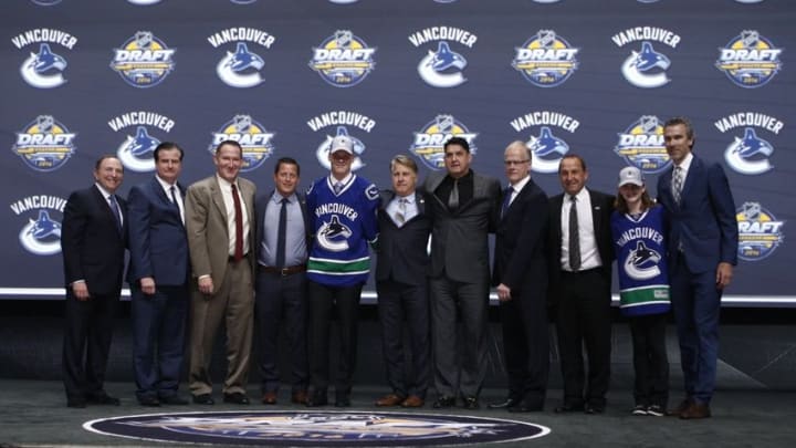 Jun 24, 2016; Buffalo, NY, USA; Olli Juolevi poses for a photo after being selected as the number five overall draft pick by the Vancouver Canucks in the first round of the 2016 NHL Draft at the First Niagra Center. Mandatory Credit: Timothy T. Ludwig-USA TODAY Sports