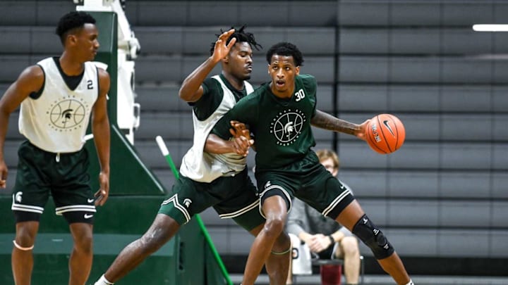 Michigan State’s Marcus Bingham Jr. moves with the ball as Julius Marble II defends during open practice on Saturday, Oct. 2, 2021, at the Breslin Center in East Lansing.Syndication Lansing State Journal