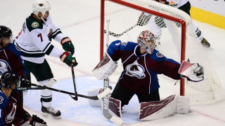 Oct 4, 2016; Denver, CO, USA; Colorado Avalanche goalie Semyon Varlamov (1) makes a save against Minnesota Wild right wing Chris Stewart (7) in the third period of a preseason hockey game at the Pepsi Center. The Avalanche defeated the Wild 2-0.Mandatory Credit: Ron Chenoy-USA TODAY Sports
