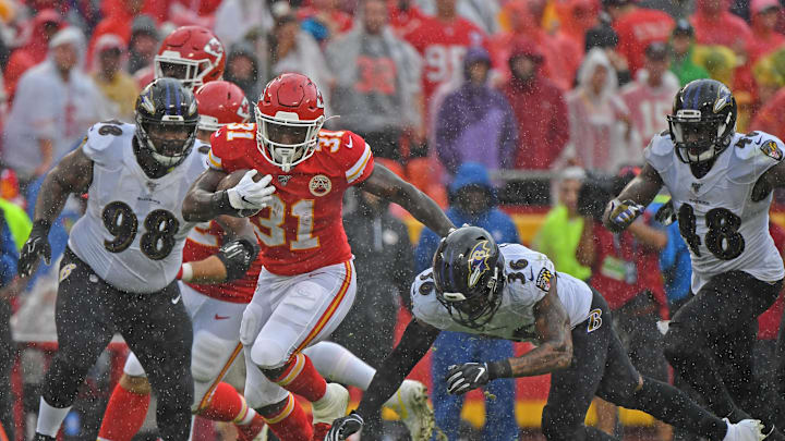 Running back Darrel Williams #31 of the Kansas City Chiefs rushes up field against defensive back Chuck Clark #36 of the Baltimore Ravens (Photo by Peter Aiken/Getty Images)