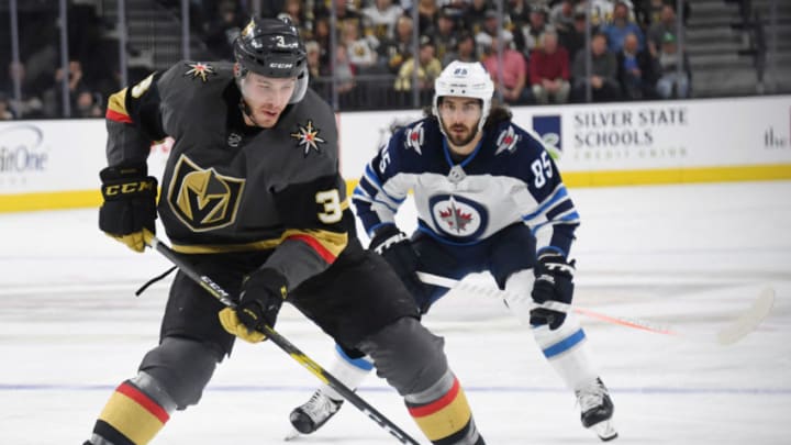 LAS VEGAS, NEVADA - MARCH 21: Brayden McNabb #3 of the Vegas Golden Knights skates with the puck ahead of Mathieu Perreault #85 of the Winnipeg Jets in the second period of their game at T-Mobile Arena on March 21, 2019 in Las Vegas, Nevada. The Golden Knights defeated the Jets 5-0. (Photo by Ethan Miller/Getty Images)