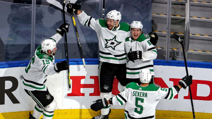 Joel Kiviranta #25 of the Dallas Stars is congratulated by his teammates after scoring the game-winning goal against the Colorado Avalanche during the first overtime period to win Game Seven of the Western Conference Second Round during the 2020 NHL Stanley Cup Playoffs at Rogers Place on September 04, 2020 in Edmonton, Alberta, Canada. (Photo by Bruce Bennett/Getty Images)
