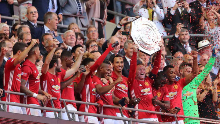 LONDON, ENGLAND - AUGUST 07: Wayne Rooney of Manchester United lifts the trophy during The FA Community Shield match between Manchester United and Leicester City at Wembley Stadium on August 7, 2016 in London, England. (Photo by Matthew Ashton - AMA/Getty Images)