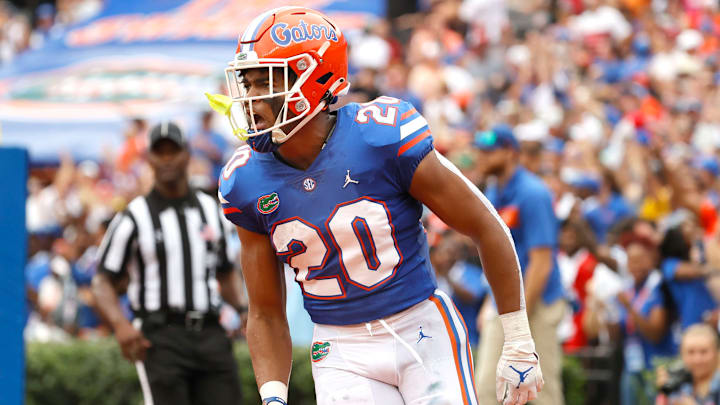 Sep 18, 2021; Gainesville, Florida, USA; Florida Gators running back Malik Davis (20) celebrates as he scores a a touchdown during the first half at Ben Hill Griffin Stadium. Mandatory Credit: Kim Klement-USA TODAY Sports