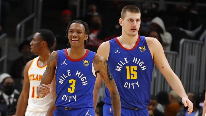 ATLANTA, GA - DECEMBER 17: Bones Hyland #3 reacts with Nikola Jokic #15 of the Denver Nuggets during the second half against the Atlanta Hawks at State Farm Arena on 17 Dec. 2021 in Atlanta, Georgia. (Photo by Todd Kirkland/Getty Images)