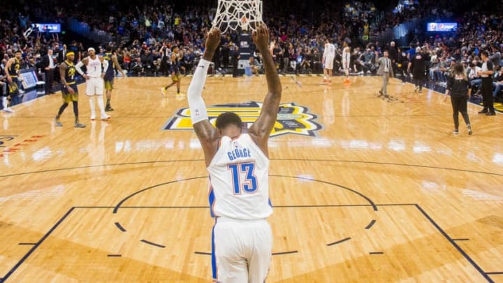 DENVER, CO - FEBRUARY 01: Paul George #13 of the Oklahoma City Thunder pulls on the net during a timeout against the Denver Nuggets at Pepsi Center on February 1, 2018 in Denver, Colorado. NOTE TO USER: User expressly acknowledges and agrees that, by downloading and or using this photograph, User is consenting to the terms and conditions of the Getty Images License Agreement. (Photo by Timothy Nwachukwu/Getty Images)