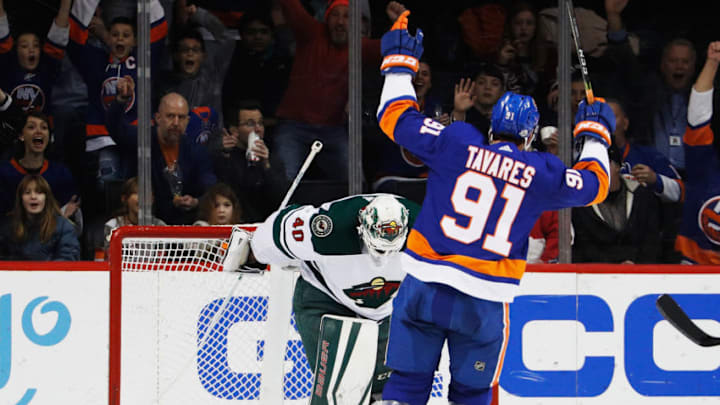 NEW YORK, NY - FEBRUARY 19: John Tavares #91 of the New York Islanders celebrates a second-period goal by teammate Anders Lee #27 (not pictured) against Devan Dubnyk #40 of the Minnesota Wild at Barclays Center on February 19, 2018 in the Brooklyn borough of New York City. (Photo by Paul Bereswill/NHLI via Getty Images)
