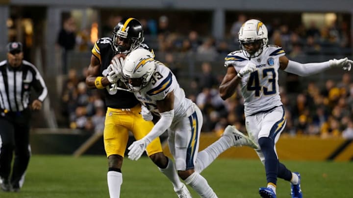 PITTSBURGH, PA - DECEMBER 02: Antonio Brown #84 of the Pittsburgh Steelers is hit after a catch by Derwin James #33 of the Los Angeles Chargers in the first half during the game at Heinz Field on December 2, 2018 in Pittsburgh, Pennsylvania. (Photo by Justin K. Aller/Getty Images)