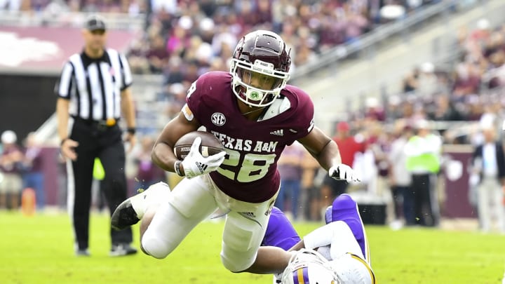 Nov 20, 2021; College Station, Texas, USA; Prairie View Am Panthers defensive back Bryce Turner (19) tackles Texas A&M Aggies running back Isaiah Spiller (28) during the first quarter at Kyle Field. Mandatory Credit: Maria Lysaker-USA TODAY Sports
