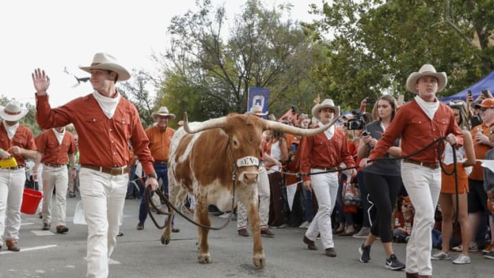 AUSTIN, TX - NOVEMBER 17: Members of the Silver Spurs escort Texas Longhorns mascot Bevo XV to the stadium before the game against the Iowa State Cyclones at Darrell K Royal-Texas Memorial Stadium on November 17, 2018 in Austin, Texas. (Photo by Tim Warner/Getty Images)