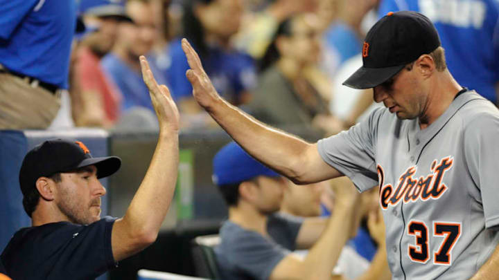 TORONTO, CANADA - JULY 3: Max Scherzer #37 of the Detroit Tigers high-fives teammate Justin Verlander #35 after being pulled in the seventh inning during MLB game action against the Toronto Blue Jays July 3, 2013 at Rogers Centre in Toronto, Ontario, Canada. (Photo by Brad White/Getty Images)