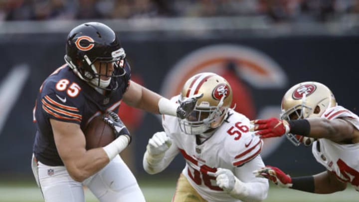 CHICAGO, IL – DECEMBER 03: Daniel Brown #85 of the Chicago Bears carries the football against Reuben Foster #56 of the San Francisco 49ers in the fourth quarter at Soldier Field on December 3, 2017 in Chicago, Illinois. The San Francisco 49ers defeated the Chicago Bears 15-14. (Photo by Joe Robbins/Getty Images)