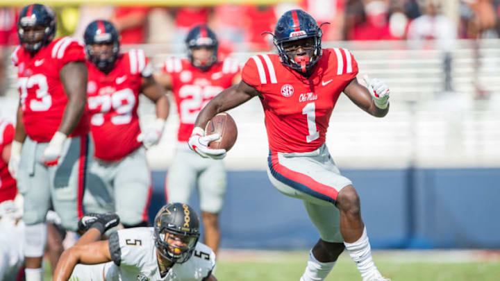 OXFORD, MS - OCTOBER 14: Wide receiver A.J. Brown #1 of the Mississippi Rebels escapes a tackle by safety LaDarius Wiley #5 of the Vanderbilt Commodores at Vaught-Hemingway Stadium on October 14, 2017 in Oxford, Mississippi. (Photo by Michael Chang/Getty Images)