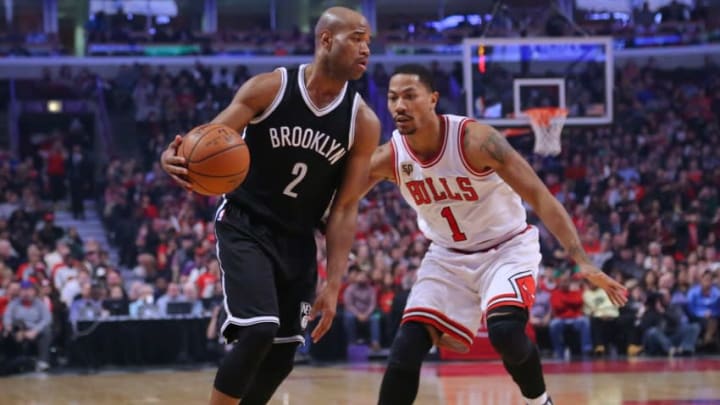 Dec 21, 2015; Chicago, IL, USA; Brooklyn Nets guard Jarrett Jack (2) is defended by Chicago Bulls guard Derrick Rose (1) during the second half at the United Center. Brooklyn won 105-102. Mandatory Credit: Dennis Wierzbicki-USA TODAY Sports