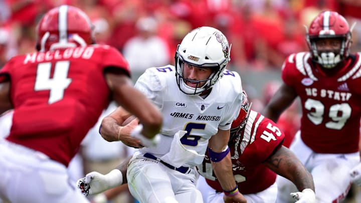 RALEIGH, NC – SEPTEMBER 01: Nick McCloud #4 and Darian Roseboro #45 of the North Carolina State Wolfpack pressure Ben DiNucci #6 of the James Madison Dukes during their game at Carter-Finley Stadium on September 1, 2018 in Raleigh, North Carolina. North Carolina State won 24-13. (Photo by Grant Halverson/Getty Images)