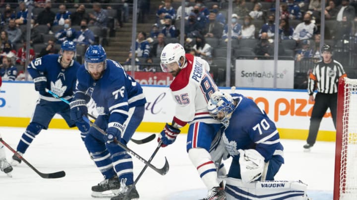 Sep 25, 2021; Toronto, Ontario, CAN; Toronto Maple Leafs defenseman T.J. Brodie (78) battles with Montreal Canadiens forward Mathieu Perreault (85) in front of Toronto Maple Leafs goaltender Ian Scott (70) during the third period at Scotiabank Arena. Mandatory Credit: Nick Turchiaro-USA TODAY Sports