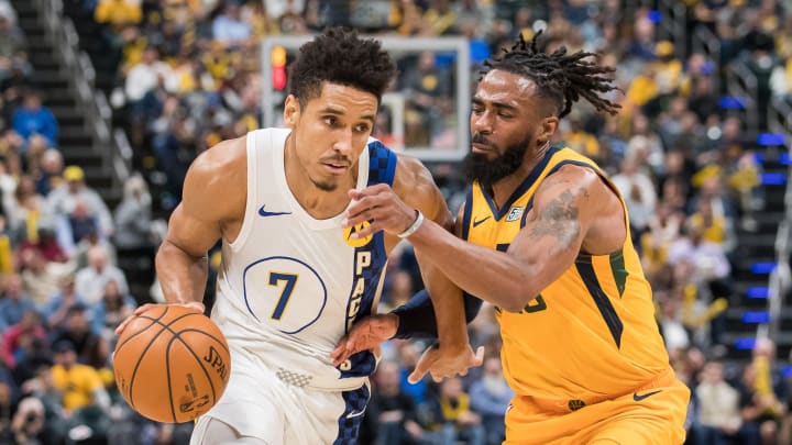 Nov 27, 2019; Indianapolis, IN, USA; Indiana Pacers guard Malcolm Brogdon (7) dribbles the ball while Utah Jazz guard Donovan Mitchell (45) defends in the second quarter at Bankers Life Fieldhouse, NBA Trades: 5 trade suitors for Malcolm Brogdon and the Indiana Pacers Mandatory Credit: Trevor Ruszkowski-USA TODAY Sports