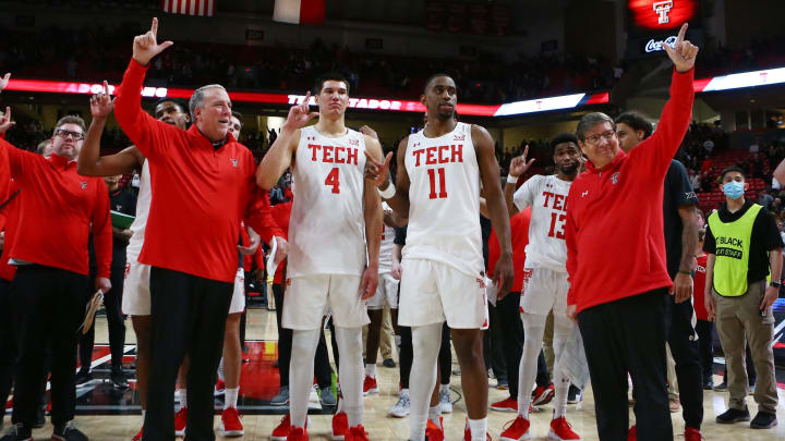 Feb 12, 2022; Lubbock, Texas, USA; Texas Tech Red Raiders chief of staff Rick Cooper, forward Daniel Batcho (4), forward Bryson Williams (11), guard Mylik Wilson (13) and head coach Mark Adams after the game against the Texas Christian Horned Frogs at United Supermarkets Arena. Mandatory Credit: Michael C. Johnson-USA TODAY Sports