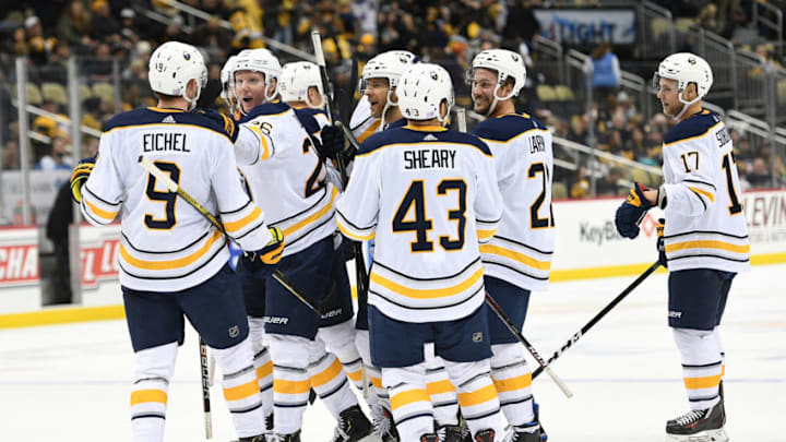 PITTSBURGH, PA - NOVEMBER 19: Jack Eichel #9 of the Buffalo Sabres celebrates with teammates after scoring the game winning goal during overtime to give the Buffalo Sabres a 5-4 win over the Pittsburgh Penguins at PPG PAINTS Arena on November 19, 2018 in Pittsburgh, Pennsylvania. (Photo by Justin Berl/Getty Images)