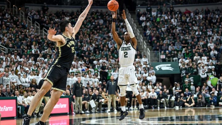 Michigan State’s Tyson Walker, right, makes a 3-pointer as Purdue’s Zach Edey defends during the second half on Monday, Jan. 16, 2023, at the Breslin Center in East Lansing.230116 Msu Purdue Bball 166a