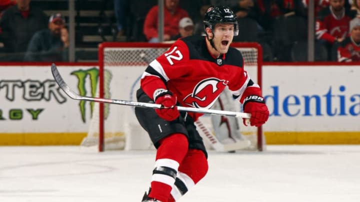 NEWARK, NJ - FEBRUARY 10: Ben Lovejoy #12 of the New Jersey Devils against the Carolina Hurricanes during the first period at the Prudential Center on February 10, 2019 in Newark, New Jersey. (Photo by Adam Hunger/Getty Images)