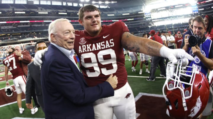 ARLINGTON, TX - SEPTEMBER 25: Dallas Cowboys owner and general manager Jerry Jones celebrates with John Ridgeway #99 of the Arkansas Razorbacks following the teams 20-10 win over the Texas A&M Aggies in the Southwest Classic at AT&T Stadium on September 25, 2021 in Arlington, Texas. (Photo by Ron Jenkins/Getty Images)