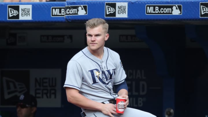 TORONTO, ON - AUGUST 11: Jake Bauers #9 of the Tampa Bay Rays looks on as he sits on the railing in the dugout during MLB game action against the Toronto Blue Jays at Rogers Centre on August 11, 2018 in Toronto, Canada. (Photo by Tom Szczerbowski/Getty Images)