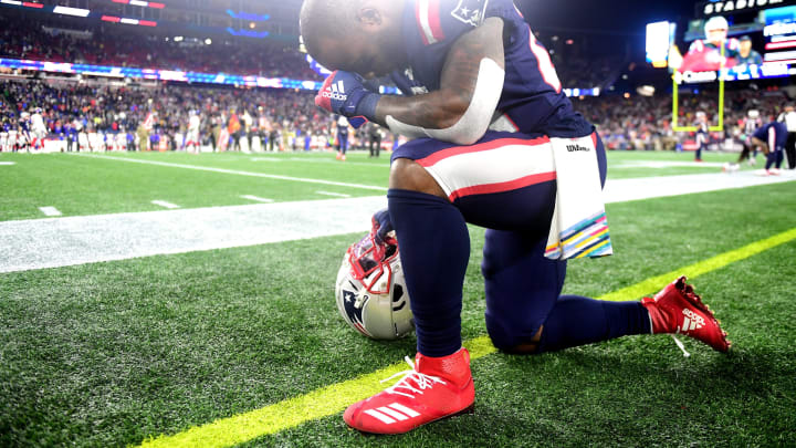 FOXBOROUGH, MASSACHUSETTS – OCTOBER 10: James White #28 of the New England Patriots kneels on the sideline prior to the game against the New York Giants at Gillette Stadium on October 10, 2019 in Foxborough, Massachusetts. (Photo by Billie Weiss/Getty Images)