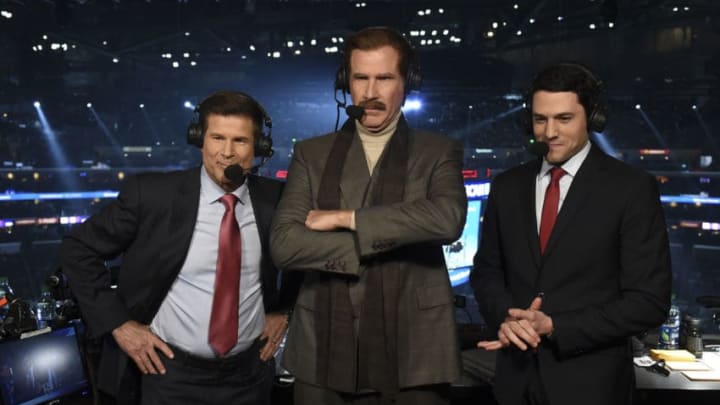 LOS ANGELES, CA - MARCH 21: Actor Will Ferrell, in character as Ron Burgundy, prepares to call the game from the broadcast booth with Fox Sports West broadcasters Jim Fox, left, and Alex Faust, right, during the second period of the game between the San Jose Sharks and the Los Angeles Kings at STAPLES Center on March 21, 2019 in Los Angeles, California. (Photo by Adam Pantozzi/NHLI via Getty Images)