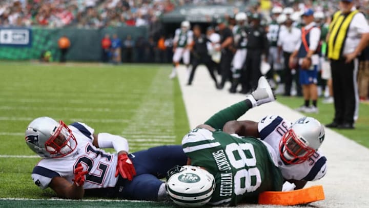 EAST RUTHERFORD, NJ - OCTOBER 15: Tight end Austin Seferian-Jenkins No. 88 of the New York Jets is seen after what was originally called a touchdown against strong safety Duron Harmon No. 30 and cornerback Malcolm Butler No. 21 of the New England Patriots during the fourth quarter of their game at MetLife Stadium on October 15, 2017 in East Rutherford, New Jersey. The Replay Official reviewed the runner broke the plane ruling, and the play was reversed and called a fumble. (Photo by Al Bello/Getty Images)