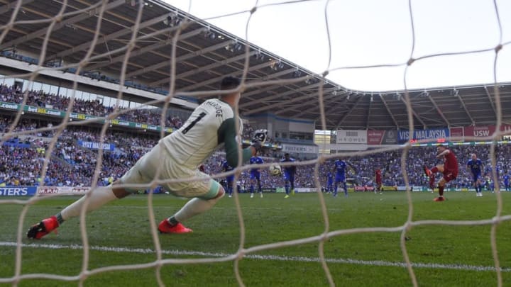 CARDIFF, WALES - APRIL 21: James Milner of Liverpool sends Neil Etheridge of Cardiff City the wrong way from the penalty spot during the Premier League match between Cardiff City and Liverpool FC at Cardiff City Stadium on April 21, 2019 in Cardiff, United Kingdom. (Photo by Mike Hewitt/Getty Images)