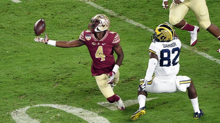 Dec 30, 2016; Miami Gardens, FL, USA; Florida State Seminoles defensive back Tarvarus McFadden (4) is unable to make a catch intended for Michigan Wolverines wide receiver Amara Darboh (82) during the first half at Hard Rock Stadium. Mandatory Credit: Steve Mitchell-USA TODAY Sports