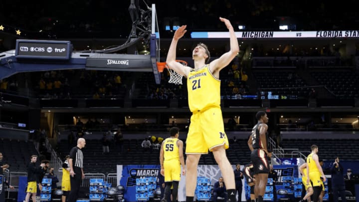 INDIANAPOLIS, INDIANA - MARCH 28: Franz Wagner #21 of the Michigan Wolverines celebrates in the final moments of the second half of their Sweet Sixteen round game against the Florida State Seminoles in the 2021 NCAA Men's Basketball Tournament at Bankers Life Fieldhouse on March 28, 2021 in Indianapolis, Indiana. (Photo by Jamie Squire/Getty Images)