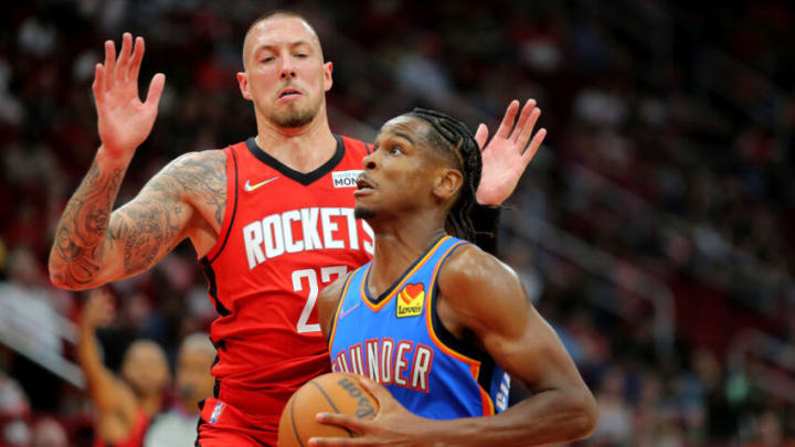 OKC Thunder guard Shai Gilgeous-Alexander (2) drives to the basket while Rockets center Daniel Theis (27) defends: Erik Williams-USA TODAY Sports