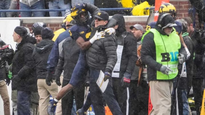 Michigan Wolverines wide receiver A.J. Henning (3) celebrates scoring a touchdown with head coach Jim Harbaugh during the first quarter of the NCAA football game at Michigan Stadium in Ann Arbor on Saturday, Nov. 27, 2021.Ohio State Buckeyes At Michigan Wolverines