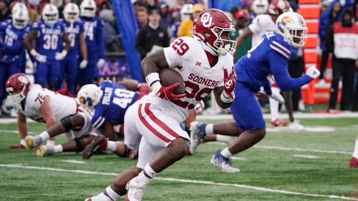 Oct 28, 2023; Lawrence, Kansas, USA; Oklahoma Sooners running back Tawee Walker (29) runs the ball against the Kansas Jayhawks during the first half at David Booth Kansas Memorial Stadium. Mandatory Credit: Denny Medley-USA TODAY Sports
