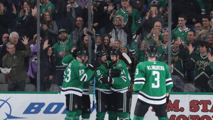 DALLAS, TX - FEBRUARY 21: Esa Lindell #23, Radek Faksa #12, Jamie Benn #14 and John Klingberg #3 of the Dallas Stars celebrate a goal against the St. Louis Blues at the American Airlines Center on February 21, 2019 in Dallas, Texas. (Photo by Glenn James/NHLI via Getty Images)