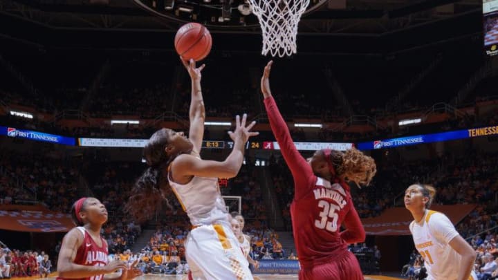 KNOXVILLE, TN - JANUARY 31: T'ea Cooper #20 of the Tennessee Lady Volunteers shoots against Diamante Martinez #35 of the Alabama Crimson Tide in a game at Thompson-Boling Arena on January 31, 2016 in Knoxville, Tennessee. (Photo by Patrick Murphy-Racey/Getty Images)