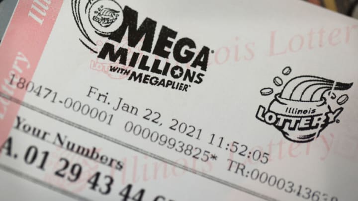 CHICAGO, ILLINOIS - JANUARY 22: Mega Millions lottery tickets are sold at a 7-Eleven store in the Loop on January 22, 2021 in Chicago, Illinois. The jackpot in the drawing has climbed to $970 million, the third highest in the game's history. (Photo Illustration by Scott Olson/Getty Images)