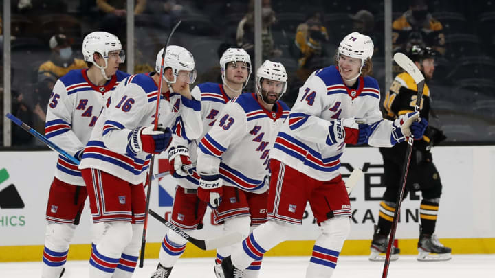 New York Rangers right wing Vitali Kravtsov (74) smiles at teammates after scoring against the Boston Bruins (Credit: Winslow Townson-USA TODAY Sports)