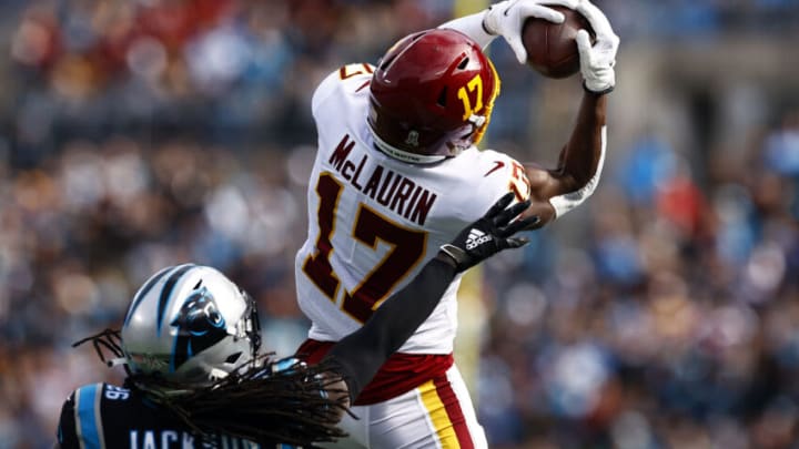 CHARLOTTE, NORTH CAROLINA - NOVEMBER 21: Terry McLaurin #17 of the Washington Football Team catches a pass for a first down over the defense of Donte Jackson #26 of the Carolina Panthers in the first quarter of the game at Bank of America Stadium on November 21, 2021 in Charlotte, North Carolina. (Photo by Jared C. Tilton/Getty Images)