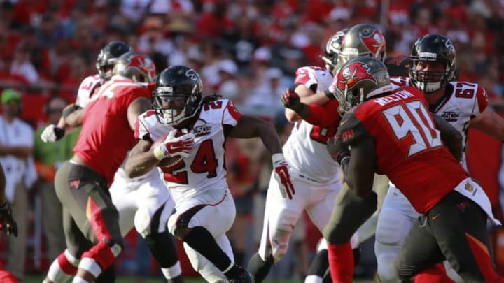 Dec 6, 2015; Tampa, FL, USA; Atlanta Falcons running back Devonta Freeman (24) runs with the ball against the Tampa Bay Buccaneers during the second half at Raymond James Stadium. Tampa Bay defeated Atlanta 23-19. Mandatory Credit: Kim Klement-USA TODAY Sports