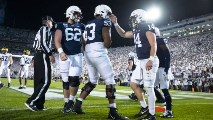 UNIVERSITY PARK, PA - OCTOBER 19: Sean Clifford #14 of the Penn State Nittany Lions celebrates a touchdown run during the second quarter against the Michigan Wolverines on October 19, 2019 at Beaver Stadium in University Park, Pennsylvania. (Photo by Brett Carlsen/Getty Images)