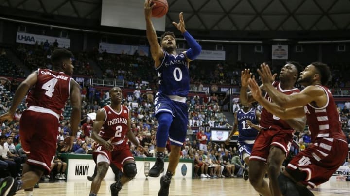 Nov 11, 2016; Honolulu, HI, USA; Kansas Jayhawks guard Frank Mason III (0) lays the ball in against Indiana Hoosiers guard James Blackmon Jr. (1) at the Stan Sheriff Center. Indiana defeats Kansas 103-99 in overtime. Mandatory Credit: Brian Spurlock-USA TODAY Sports