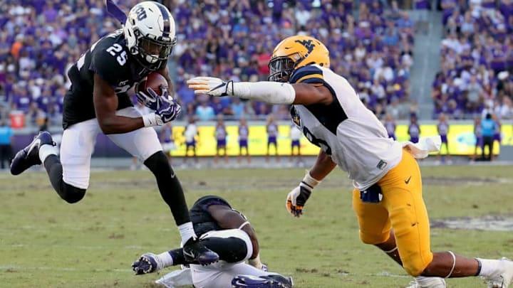 FORT WORTH, TX - OCTOBER 07: KaVontae Turpin #25 of the TCU Horned Frogs carries the ball against Kyzir White #8 of the West Virginia Mountaineers in the fourth quarter at Amon G. Carter Stadium on October 7, 2017 in Fort Worth, Texas. (Photo by Tom Pennington/Getty Images)