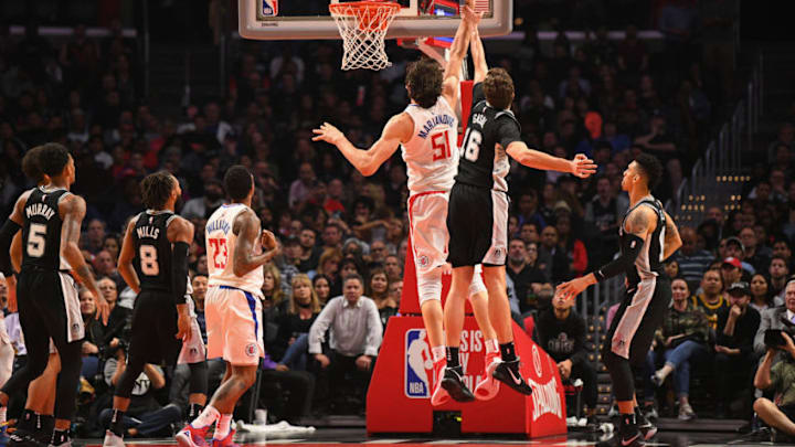 LOS ANGELES, CA - APRIL 03: Los Angeles Clippers Center Boban Marjanovic (51) is fouled by San Antonio Spurs Center Pau Gasol (16) during an NBA game between the San Antonio Spurs and the Los Angeles Clippers on April 3, 2018 at STAPLES Center in Los Angeles, CA. (Photo by Brian Rothmuller/Icon Sportswire via Getty Images)