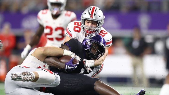 ARLINGTON, TX – SEPTEMBER 15: Jalen Reagor #1 of the TCU Horned Frogs is tackled by Nick Bosa #97 and Pete Werner #20 of the Ohio State Buckeyes in the second quarter during The AdvoCare Showdown at AT&T Stadium on September 15, 2018 in Arlington, Texas. (Photo by Ronald Martinez/Getty Images)