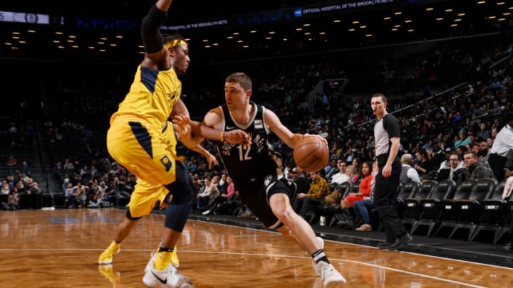 BROOKLYN, NY - FEBRUARY 14: Joe Harris #12 of the Brooklyn Nets drives to the basket against Myles Turner #33 of the Indiana Pacers during the game between the two teams on February 14, 2018 at Barclays Center in Brooklyn, New York. NOTE TO USER: User expressly acknowledges and agrees that, by downloading and or using this Photograph, user is consenting to the terms and conditions of the Getty Images License Agreement. Mandatory Copyright Notice: Copyright 2018 NBAE (Photo by Matteo Marchi/NBAE via Getty Images)